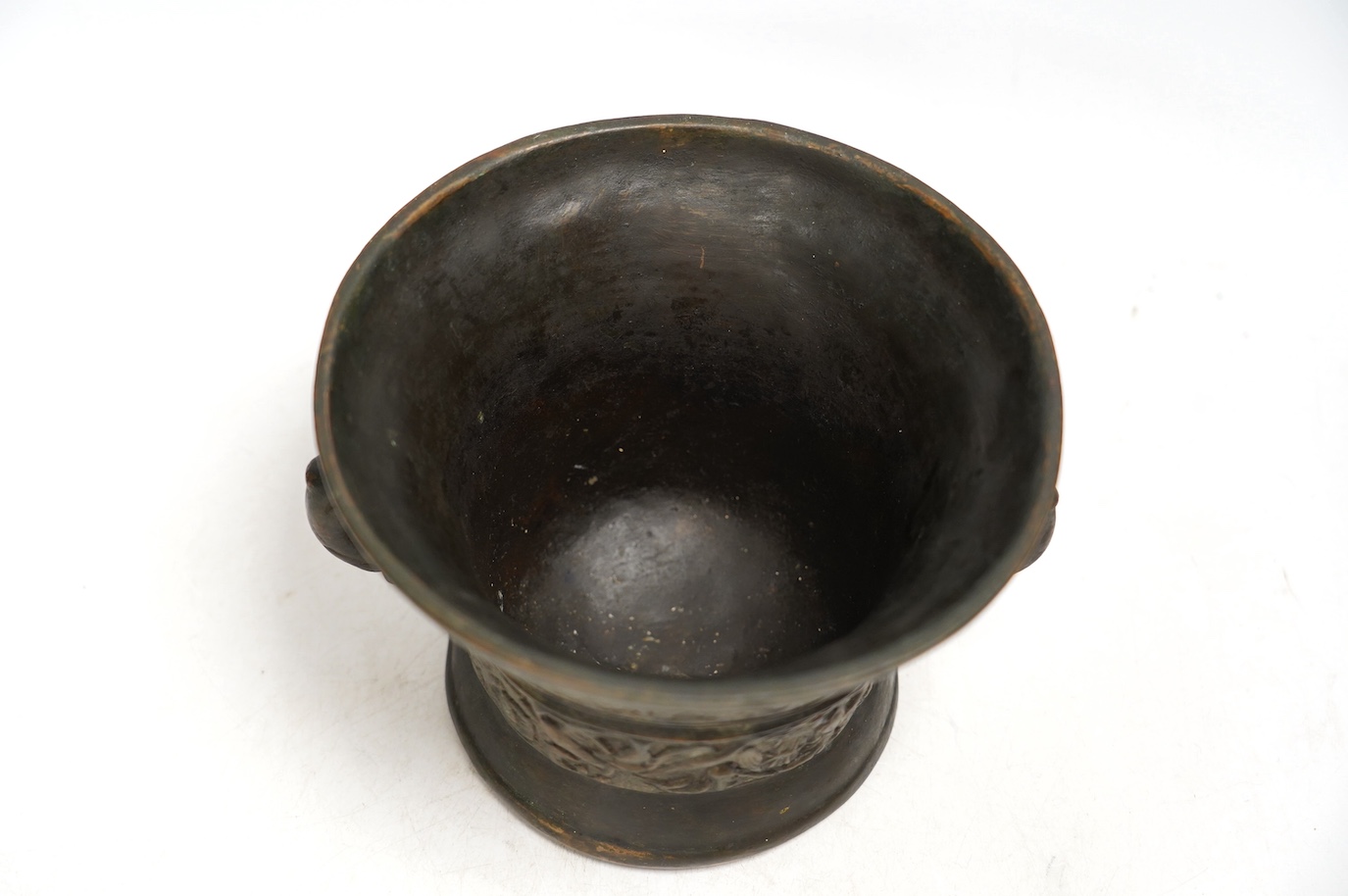 After Heinrich Ter Horst, a heavy cast bronze twin handled mortar, 13cm high. Condition - fair